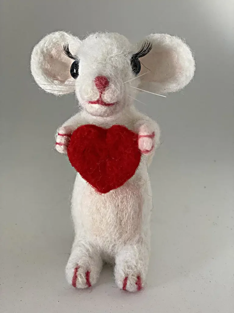 Needle felt wool mouse holding heart